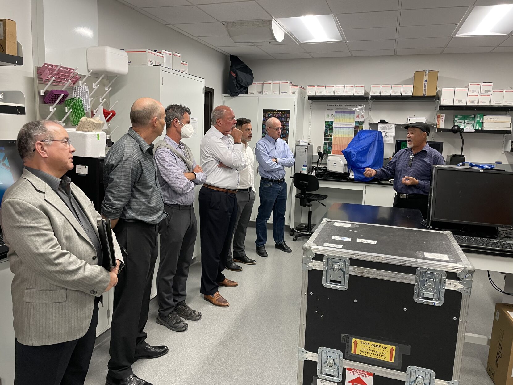 gives a tour of his lab to members of the New Mexico Angels.